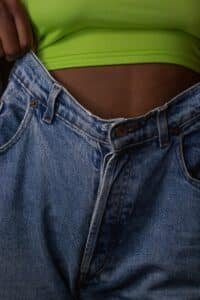 person in blue denim jeans